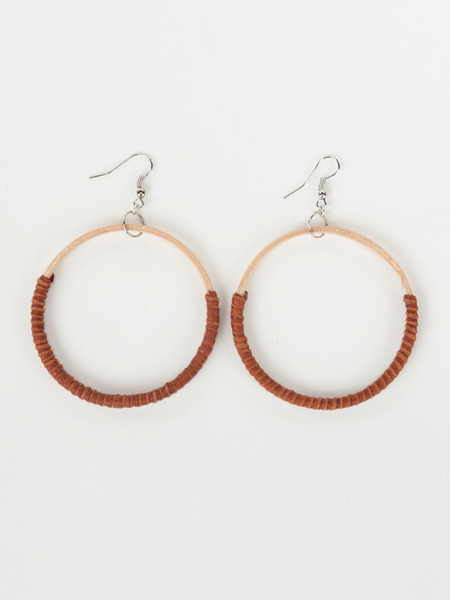 Tan leather Hispaniola Hoop Earrings with individually crafted wooden circle centerpiece. Front view.