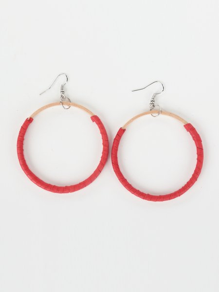 Red leather Hispaniola Hoop Earrings with individually crafted wooden circle centerpiece. Front view.