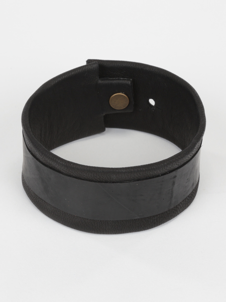 Black Leather and Tire Cuff featuring upcycled inner tube and snap closure. Top view.