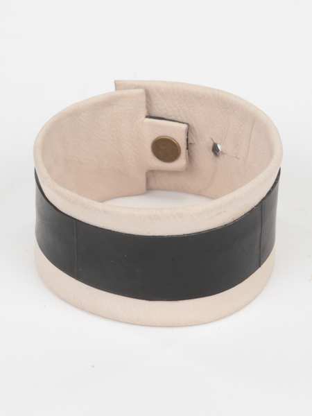 Natural Leather and Tire Cuff featuring upcycled inner tube and snap closure. Top view.