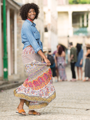 Leather Anne Sandals with Upcycled Tire Tread Soles, and Cognac Upper by deux mains. Wide shot of female model in long skirt. 