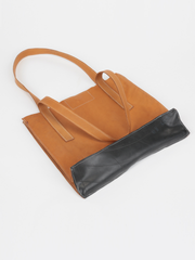 Tan leather Classic City Tote with inner tube bottom panel, and magnetic closure by deux mains. Bottom view showing inner tube bottom panel. 