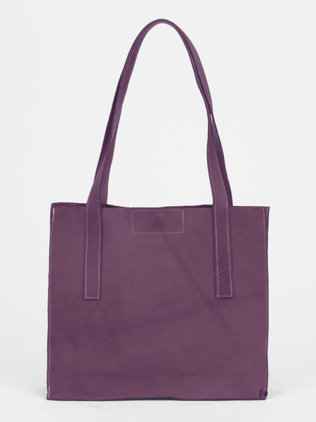  Plum leather Classic City Tote with inner tube bottom panel, and magnetic closure by deux mains. Front view.