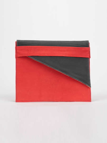 Red leather City Classic Clutch, with diagonal black contrast fold-over by deux mains. Front view.