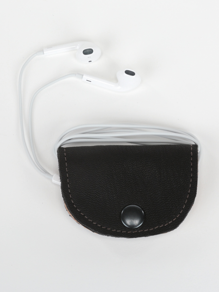 Black and natural leather  Bèl Mizik Earbud Holder with snap closure. Front view of product showcasing organized earbuds.