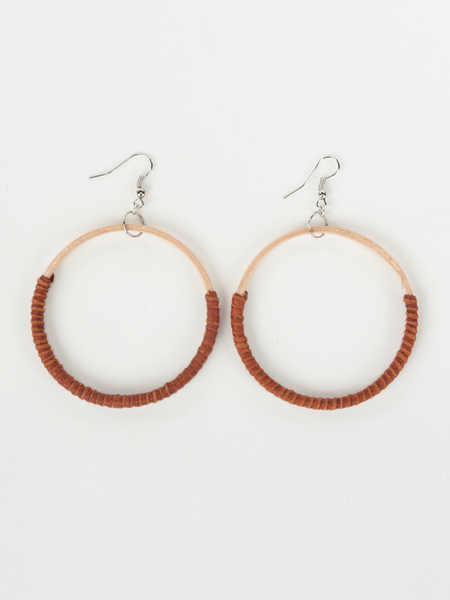 Tan leather Hispaniola Hoop Earrings with individually crafted wooden circle centerpiece. Front view. 