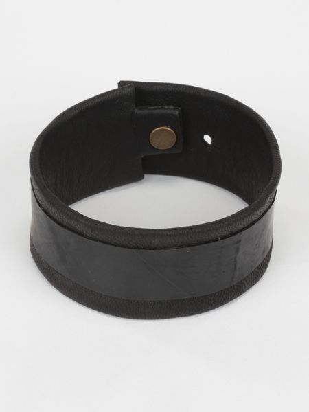 Black Leather and Tire Cuff featuring upcycled inner tube and snap closure. Top view. 