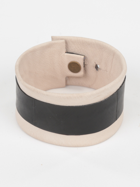 Natural Leather and Tire Cuff featuring upcycled inner tube and snap closure. Top view. 