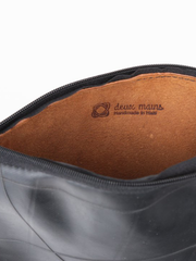 Inner tube and tan leather Maudernise Pouch with zipper closure, by deux mains. Detailed view of interior showing deux mains logo and zipper closure. 